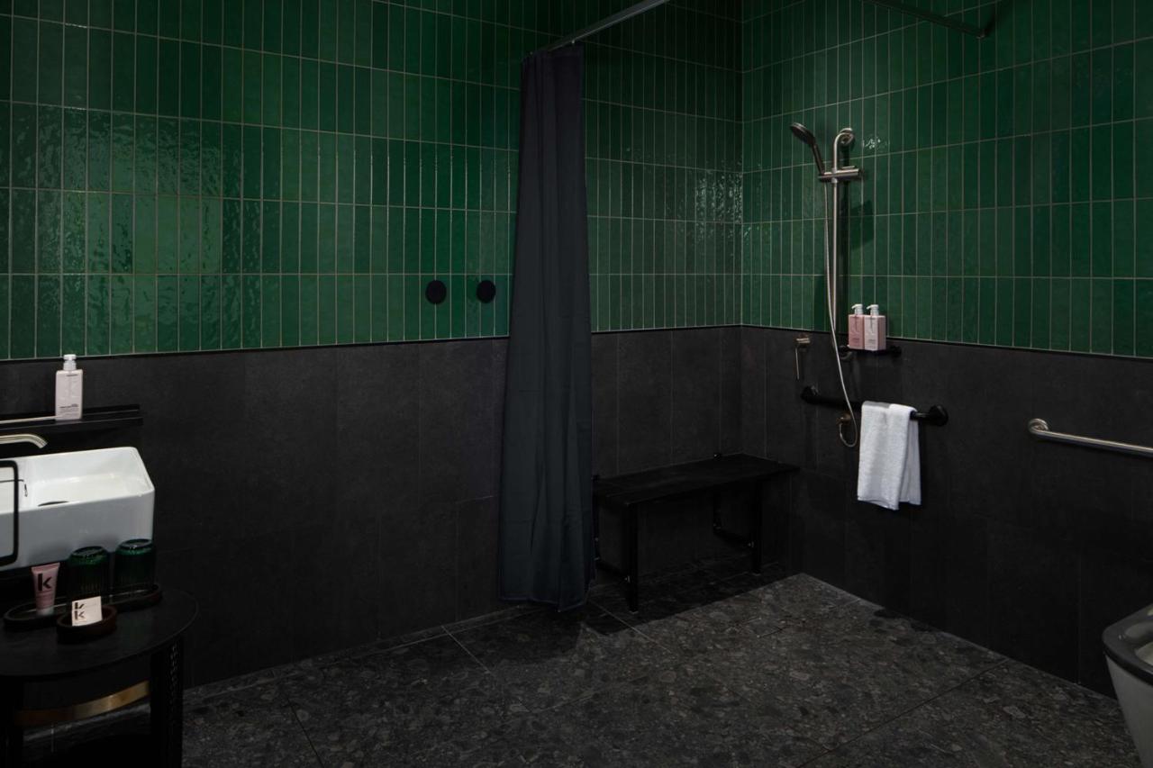 Qt Newcastle Hotel Exterior photo A shower with a shower curtain